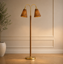 Hudson Valley Ruthin 60 in Two Light Floor Light in Aged Brass with Rattan Shades.